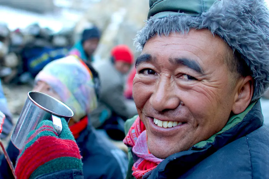 A guy having a warm drink