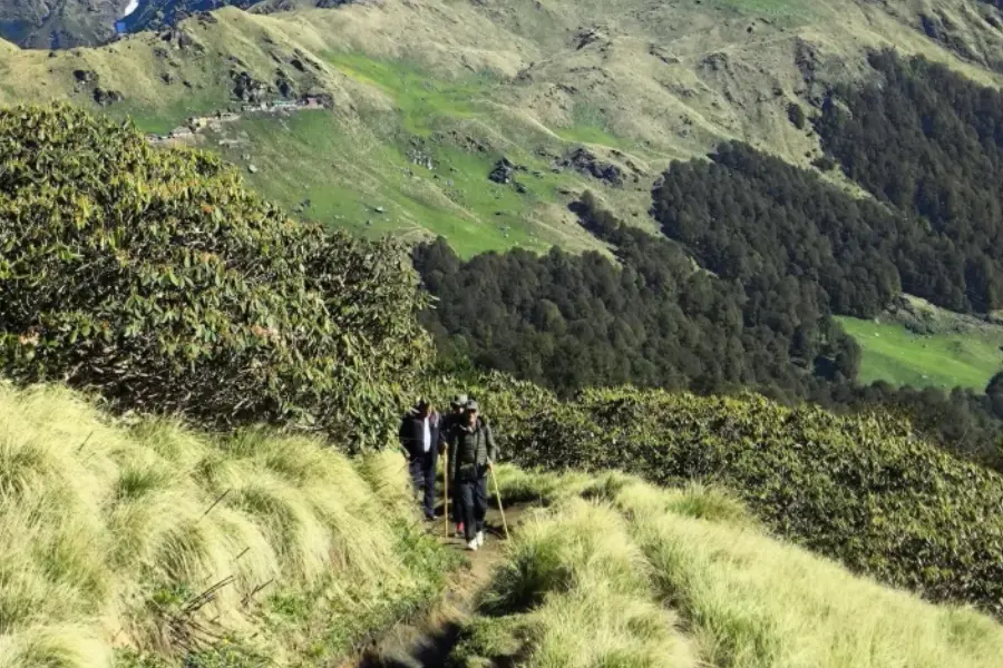 View of Hikers walking along a scenic mountain trail in Dodital.